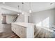 Open concept kitchen with island that flows into the living area and features wood flooring at 2350 Hedgecliff Rd, Kannapolis, NC 28025