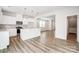 Modern kitchen with stainless steel appliances, an island with bar seating, and wood floors at 2350 Hedgecliff Rd, Kannapolis, NC 28025
