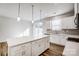 Bright kitchen with a large island, white cabinets, and modern pendant lighting at 2350 Hedgecliff Rd, Kannapolis, NC 28025