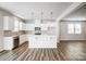 Bright and open kitchen with white cabinetry, stainless steel appliances, and a functional center island at 2350 Hedgecliff Rd, Kannapolis, NC 28025