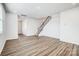 Inviting living area with modern floors, showcasing open layout and access to the staircase and other rooms at 2350 Hedgecliff Rd, Kannapolis, NC 28025