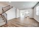 Open-concept living room features modern floors, ample lighting, and seamless flow to the kitchen at 2350 Hedgecliff Rd, Kannapolis, NC 28025