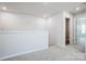 Open loft area with neutral carpet and views to the second bedroom at 2350 Hedgecliff Rd, Kannapolis, NC 28025