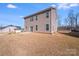 Siding view of the back of the house, showcasing the patio, dry lawn, and surrounding trees at 245 Pine Eagle Dr, Rock Hill, SC 29732