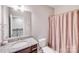 Well-lit bathroom features granite countertops, a modern vanity, and a shower with patterned curtain at 245 Pine Eagle Dr, Rock Hill, SC 29732