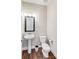 Bathroom with a pedestal sink, wooden floors, and a toilet at 245 Pine Eagle Dr, Rock Hill, SC 29732