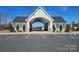 Community entrance with covered arched entry, parking spaces, and landscaping at 245 Pine Eagle Dr, Rock Hill, SC 29732