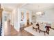 Elegant dining room featuring hardwood floors, a modern chandelier, and stylish decor at 245 Pine Eagle Dr, Rock Hill, SC 29732
