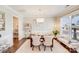 Elegant dining room featuring hardwood floors, a modern chandelier, and stylish decor at 245 Pine Eagle Dr, Rock Hill, SC 29732