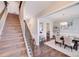 Bright entryway with staircase, hardwood floors and view into formal dining room at 245 Pine Eagle Dr, Rock Hill, SC 29732