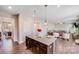 Open kitchen with granite counters, stainless appliances, dark wood cabinetry, and hardwood flooring at 245 Pine Eagle Dr, Rock Hill, SC 29732