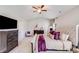 Comfortable main bedroom featuring carpet, a vaulted ceiling, and an adjoining sitting room and bathroom at 245 Pine Eagle Dr, Rock Hill, SC 29732