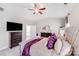 Bright main bedroom with a TV, dresser with mirror, and a vaulted ceiling with ceiling fan at 245 Pine Eagle Dr, Rock Hill, SC 29732