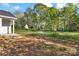 Picture of a backyard getting ready to be landscaped with beautiful tall trees surrounding the lot at 265 Duke Dr, Salisbury, NC 28146