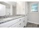 Bathroom featuring granite countertop vanity with double sinks, lighting, and wood floor at 265 Duke Dr, Salisbury, NC 28146