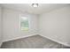 A well-lit bedroom has neutral paint, carpet, a window, and a flush-mounted ceiling light at 265 Duke Dr, Salisbury, NC 28146