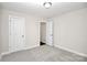Bedroom featuring neutral paint, carpet, 2 doors, one leading to a closet at 265 Duke Dr, Salisbury, NC 28146