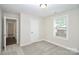 A bedroom featuring neutral paint, carpet, window, with 2 doors, one leading to a closet at 265 Duke Dr, Salisbury, NC 28146