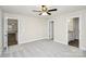 Large bedroom with ensuite bathroom, carpet floors, and ceiling fan at 265 Duke Dr, Salisbury, NC 28146