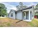 A one-story home with gray siding, white trim, and a covered porch with white columns at 265 Duke Dr, Salisbury, NC 28146