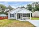 Charming home with a covered front porch, gray siding and black shutters at 265 Duke Dr, Salisbury, NC 28146