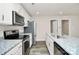 Kitchen with granite countertops, stainless steel appliances, and white cabinets at 265 Duke Dr, Salisbury, NC 28146