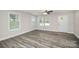 Bright living room featuring grey wood-look flooring and a view of the home's entrance at 265 Duke Dr, Salisbury, NC 28146