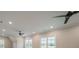 Spacious bonus room with plenty of natural light and ceiling fans at 310 Sugar Maple Ln, Weddington, NC 28104