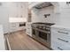 Modern kitchen with stainless steel appliances, custom cabinets, and quartz counters at 310 Sugar Maple Ln, Weddington, NC 28104
