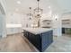 Stylish kitchen with a large center island, custom cabinets, and modern pendant lighting at 310 Sugar Maple Ln, Weddington, NC 28104