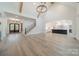 Spacious living room with hardwood floors, high ceilings, and staircase at 310 Sugar Maple Ln, Weddington, NC 28104