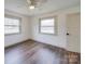 Bedroom featuring new hardwood floors, neutral paint, and natural light at 337 Glenwood Dr, Mooresville, NC 28115