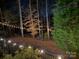 Cozy backyard featuring string lights, mature trees, and a tranquil setting, perfect for relaxing evenings outdoors at 341 Fischer Rd, Fort Mill, SC 29715