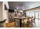 A basement bar offers seating for four, with stone accents and modern appliances, creating an entertainment space at 341 Fischer Rd, Fort Mill, SC 29715