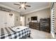 Neutral-toned bedroom with crown moulding, a TV and fun decor at 341 Fischer Rd, Fort Mill, SC 29715