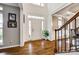 Grand foyer with soaring ceilings, hardwood floors, and staircase at 341 Fischer Rd, Fort Mill, SC 29715