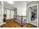 Second floor hallway with wood floors, wainscoting, and access to bedrooms at 341 Fischer Rd, Fort Mill, SC 29715