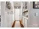 Hallway with wainscoting, hardwood floors, and storage at 341 Fischer Rd, Fort Mill, SC 29715