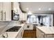 Open kitchen with gas range and stainless appliances with view to breakfast area at 341 Fischer Rd, Fort Mill, SC 29715
