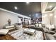 Basement living room with modern décor and comfortable seating, adjacent to wet bar provides ample room at 341 Fischer Rd, Fort Mill, SC 29715