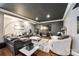 Elegant living room with dark ceiling, large TV, comfortable seating, and stylish decor create inviting space at 341 Fischer Rd, Fort Mill, SC 29715