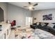 Large, open living room with gray walls, a TV and a colorful rug at 341 Fischer Rd, Fort Mill, SC 29715