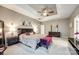 Primary bedroom with tray ceilings, modern furnishings and ensuite bathroom at 341 Fischer Rd, Fort Mill, SC 29715