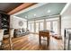 Bright recreation room with a foosball table, and ample seating near the large windows and glass doors at 341 Fischer Rd, Fort Mill, SC 29715