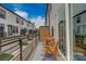 Private balcony with a wooden table and chairs; ideal for enjoying the outdoors in a comfortable setting at 348 Catawba Ave, Davidson, NC 28036