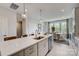 This kitchen island has bar seating that overlooks the dining area and the backyard at 348 Catawba Ave, Davidson, NC 28036