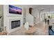 The living room features a fireplace, an elegant decor, and transitions to a modern kitchen at 348 Catawba Ave, Davidson, NC 28036