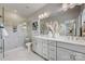 Luxurious main bathroom with double vanity, glass-enclosed shower, and elegant marble accents throughout at 348 Catawba Ave, Davidson, NC 28036