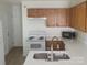 Bright kitchen with white countertops, oak cabinets, and modern stainless steel faucet at 351 Haigler St, Rock Hill, SC 29732