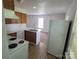 Functional kitchen with oak cabinets, white countertops, a stainless steel faucet, and open access to a dining area at 351 Haigler St, Rock Hill, SC 29732